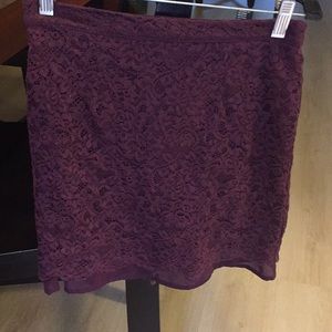 Purple/ maroon skirt.